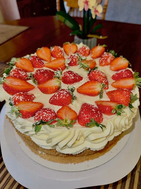 Custom strawberry sponge cake with fresh strawberry garnish
